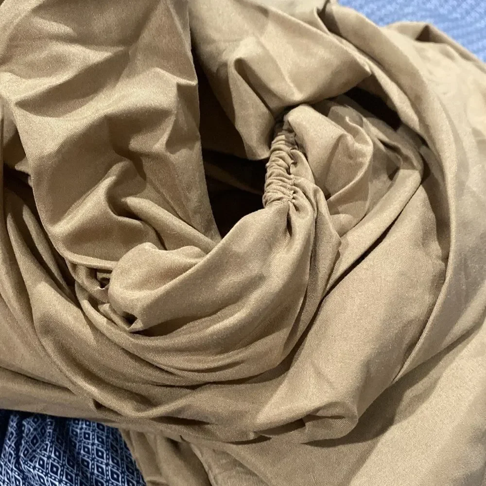 Queen size pillowcases flat, and fitted sheet in a gold color